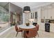 Kitchen breakfast nook with marble top table and view of the pool at 7267 Se 12Th Cir, Ocala, FL 34480