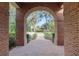 Brick archway entry to backyard at 7267 Se 12Th Cir, Ocala, FL 34480