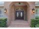 Double doors with arched brick entry at 7267 Se 12Th Cir, Ocala, FL 34480