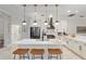 Modern kitchen featuring white cabinets, a large island, and pendant lighting at 7267 Se 12Th Cir, Ocala, FL 34480