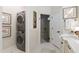 Stackable washer and dryer with a small bathroom adjacent at 7267 Se 12Th Cir, Ocala, FL 34480