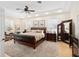 Luxurious main bedroom with a plush leather bed and ample space at 7267 Se 12Th Cir, Ocala, FL 34480