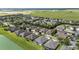 Aerial view of houses near a lake in a residential area at 7646 Sw 100Th Ct, Ocala, FL 34481