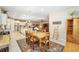 Bright dining room features a rustic wooden table with seating for six at 7646 Sw 100Th Ct, Ocala, FL 34481