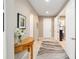 Bright and airy entryway with tile flooring, a wooden console table, and access to other rooms at 7646 Sw 100Th Ct, Ocala, FL 34481