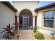 Front entry with screened porch and walkway at 7646 Sw 100Th Ct, Ocala, FL 34481