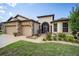 Two-story house with a three-car garage and nicely landscaped lawn at 7646 Sw 100Th Ct, Ocala, FL 34481