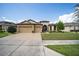 Two-story house with a three-car garage and nicely landscaped lawn at 7646 Sw 100Th Ct, Ocala, FL 34481