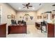 Home office boasts built-in shelving and a spacious work area at 7646 Sw 100Th Ct, Ocala, FL 34481