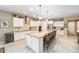 Modern kitchen with island, stainless steel appliances, and granite countertops at 7646 Sw 100Th Ct, Ocala, FL 34481