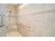 Walk-in shower with grab bars and tile surround at 7646 Sw 100Th Ct, Ocala, FL 34481