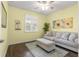 Relaxing bedroom with light walls, neutral decor, and wood floors at 7977 Sw 85Th Loop, Ocala, FL 34476