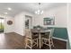 Charming dining room with round table and four chairs, hardwood floors at 7977 Sw 85Th Loop, Ocala, FL 34476