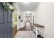 Bright and airy entryway with wood-look floors and a console table at 7977 Sw 85Th Loop, Ocala, FL 34476