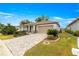 One-story home with landscaped yard, paver driveway and two-car garage at 7977 Sw 85Th Loop, Ocala, FL 34476