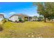 Single story home with screened patio, manicured lawn and landscaping at 7977 Sw 85Th Loop, Ocala, FL 34476