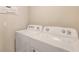 Convenient laundry room with Whirlpool washer and dryer at 8503 Las Palmas Way, Wildwood, FL 34785