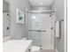 Bathroom with shower, toilet, and vanity with white cabinets at 8749 Sw 93Rd Cir, Ocala, FL 34481