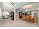 Dining room with a wooden table and chairs, and a view into the kitchen and living areas at 8749 Sw 93Rd Cir, Ocala, FL 34481