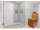 Clean and bright hallway with a view of a door and storage at 8749 Sw 93Rd Cir, Ocala, FL 34481