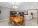 Kitchen with an island and white cabinets, view of dining area at 8749 Sw 93Rd Cir, Ocala, FL 34481