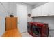 Bright laundry room, with washer, dryer, and extra storage at 8749 Sw 93Rd Cir, Ocala, FL 34481