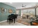 Living room with a grand piano and comfortable seating at 8749 Sw 93Rd Cir, Ocala, FL 34481