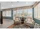 Relaxing sunroom with comfortable seating and plantation shutters at 8749 Sw 93Rd Cir, Ocala, FL 34481