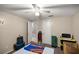 Bedroom with double bed, ceiling fan, and access to bathroom at 876 Ne 71St Ln, Ocala, FL 34479