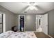 Bedroom with double bed, closet, and access to another room at 876 Ne 71St Ln, Ocala, FL 34479