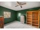 Simple bedroom with wood shelving and window at 876 Ne 71St Ln, Ocala, FL 34479