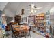 Dining area with round wooden table, chairs, and a large storage unit at 876 Ne 71St Ln, Ocala, FL 34479