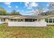 Backyard with a screened porch and white fence at 8877 Sw 96Th St # B, Ocala, FL 34481