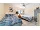 Bedroom with two twin beds and a ceiling fan at 8877 Sw 96Th St # B, Ocala, FL 34481