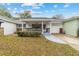 Inviting exterior of a single story home with a covered porch and well-manicured lawn at 8877 Sw 96Th St # B, Ocala, FL 34481