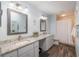 Bright bathroom with granite countertops, double sinks, modern fixtures, and a tiled shower at 9051 Sw 96Th Ln # B, Ocala, FL 34481