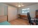 This cozy bedroom features a ceiling fan, closet, and neutral walls at 9051 Sw 96Th Ln # B, Ocala, FL 34481