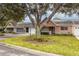 Charming villa with a tree-lined street and well-maintained landscaping at 9051 Sw 96Th Ln # B, Ocala, FL 34481