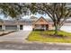 Charming single-story home featuring a well-manicured lawn, a driveway, and a welcoming facade at 9051 Sw 96Th Ln # B, Ocala, FL 34481