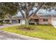 Attractive home featuring a lush front lawn, mature trees, and a charming, inviting facade at 9051 Sw 96Th Ln # B, Ocala, FL 34481