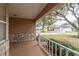 View of the covered front porch and stone detailing at 9051 Sw 96Th Ln # B, Ocala, FL 34481