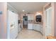 Cozy kitchen with a white refrigerator and appliances, tile floors, and light pink walls at 9051 Sw 96Th Ln # B, Ocala, FL 34481