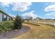 Landscaped backyard with a white fence at 9253 Sw 86Th Pl, Ocala, FL 34481