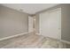 Bedroom with wood-look floors, and sliding closet doors at 9253 Sw 86Th Pl, Ocala, FL 34481