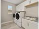 Laundry room with washer, dryer, cabinets, and sink at 9253 Sw 86Th Pl, Ocala, FL 34481