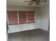 Room with wood paneling and neutral carpeting at 9359 Bahia Rd, Ocala, FL 34472