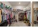 Spacious walk-in closet with ample shelving and hanging space at 9411 Sw 54Th St, Ocala, FL 34481