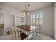 Bright dining area with a farmhouse table and built-in hutch at 9411 Sw 54Th St, Ocala, FL 34481