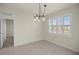 Charming dining room with chandelier and window with plantation shutters at 9411 Sw 54Th St, Ocala, FL 34481