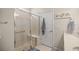 Walk-in shower with glass enclosure and built-in seat at 9411 Sw 54Th St, Ocala, FL 34481